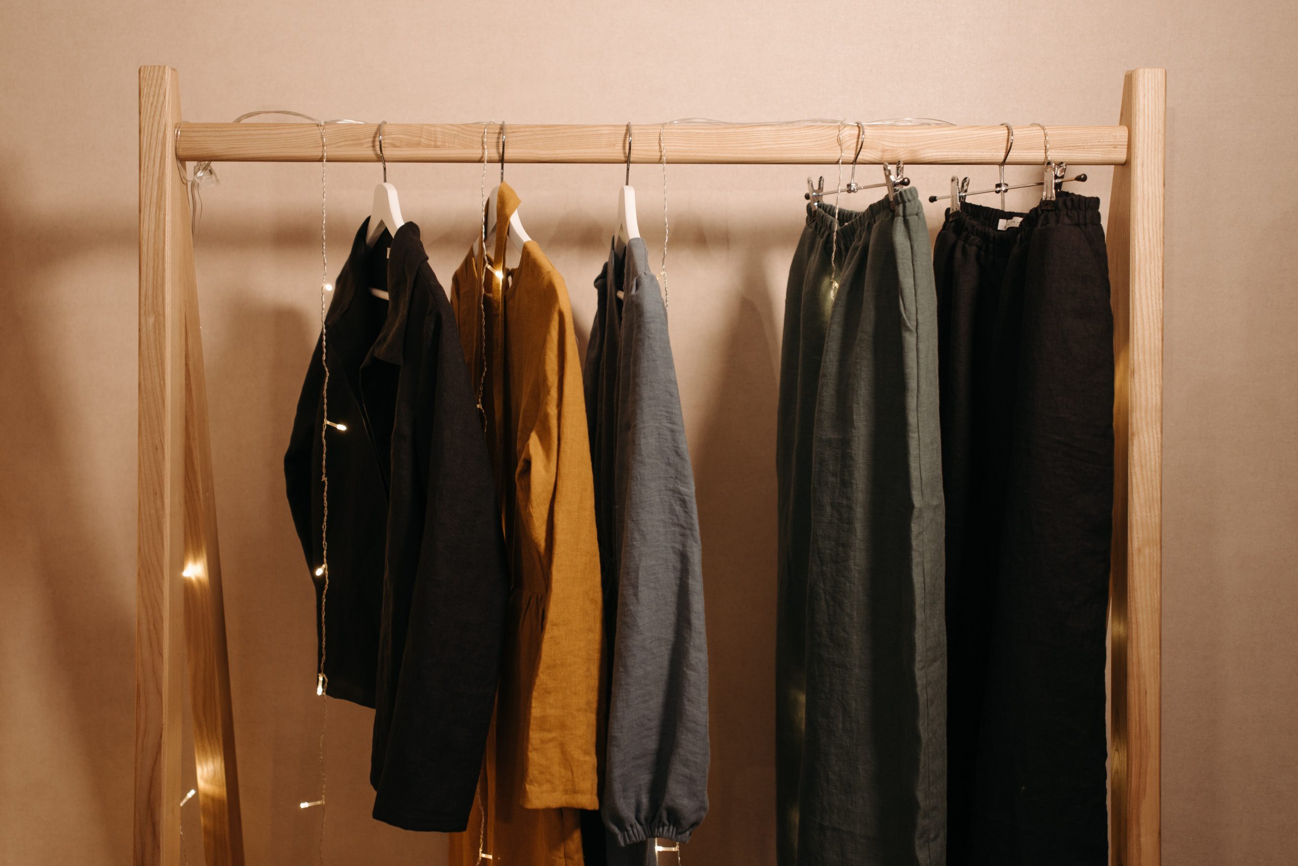 minimalist and organized clothes rack with light string