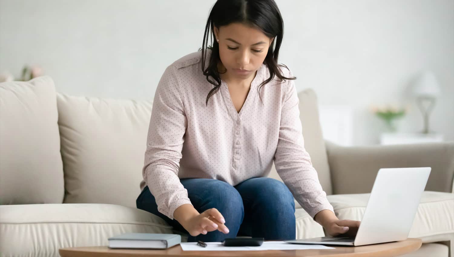 Woman calculating rent expenses